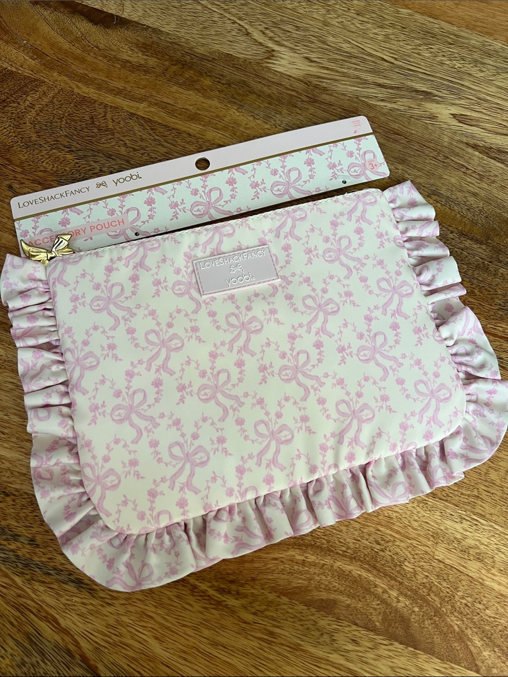 LoveShackFancy Kids Bow Print Ruffle Pouch in Pink and Cream